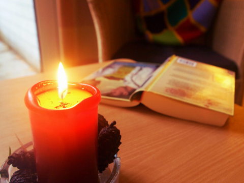 book, candle, half read book, reading